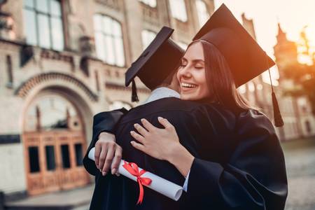 83757000-graduates-in-mantles-with-diplomas-in-hands-are-standing-near-university-and-hugging-each-other- (1).jpg 83757000-graduates-in-mantles-with-diplomas-in-hands-are-standing-near-university-and-hugging-each-other- (1).jpg